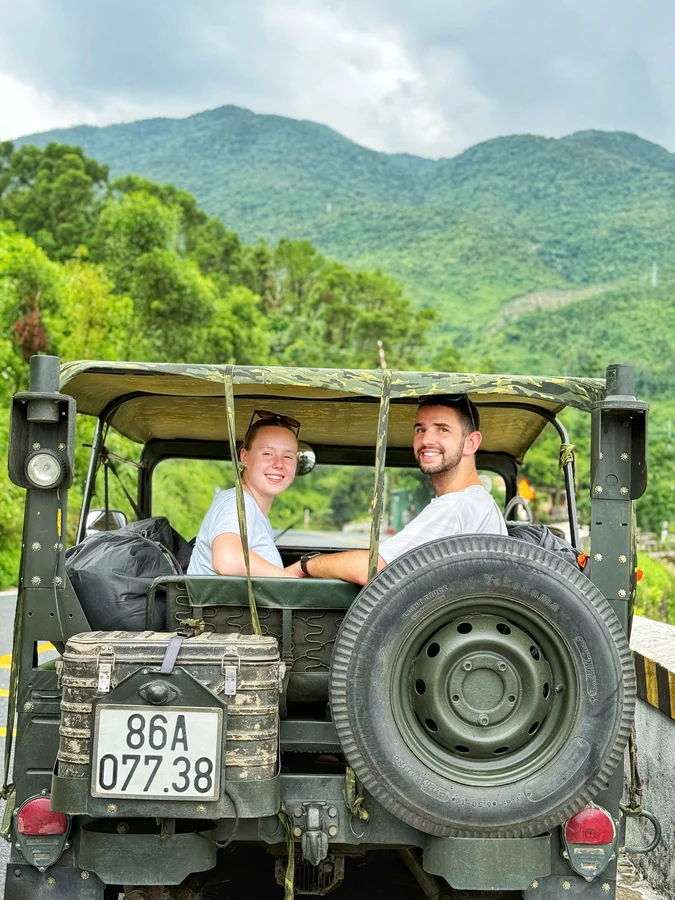 Couple in Jeep back seat mountains Hai Van