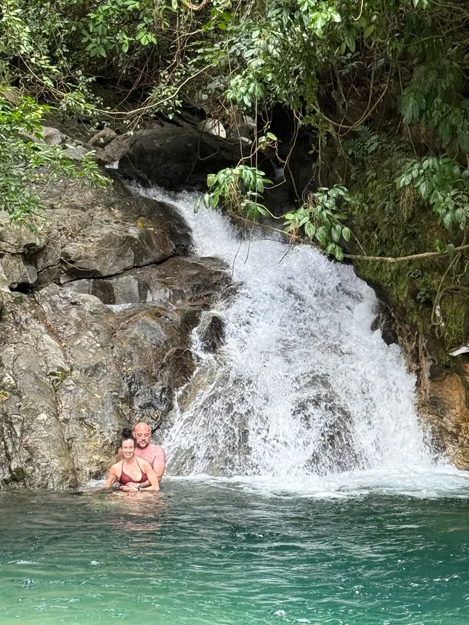 Couple swimming waterfall Hai Van Pass DDTravel