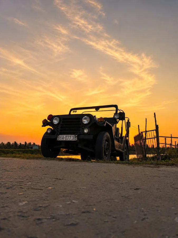DDTravel vintage Jeep sunset silhouette countryside Hoi An