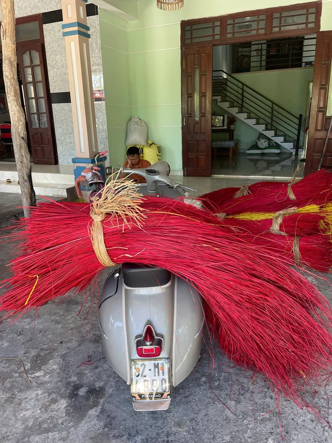 Vespa loaded with mat weaving sedge Hoi An countryside